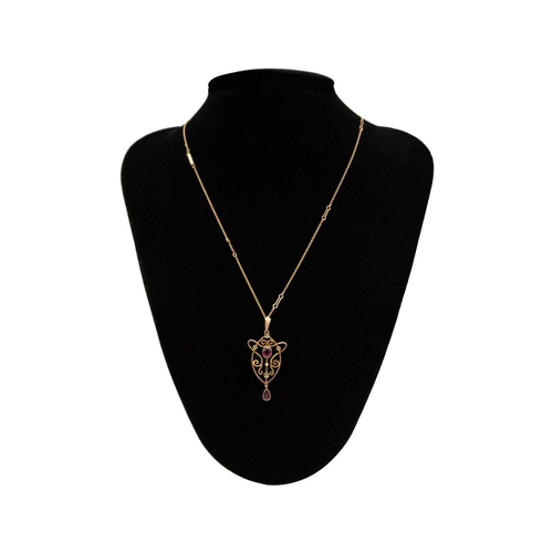 234 - An Edwardian 9ct rose gold garnet and pearl set pendant on 9ct chain. Art nouveau trace and spaced b... 