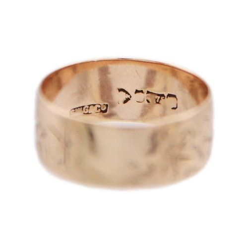 248 - A 9ct rose gold wide band ring. The whole foliate engraved, hallmarked Chester, size R, 3.48g.