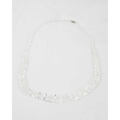 265 - A faceted graduated rock crystal quartz and glass bead necklace The necklace has screwable white met... 