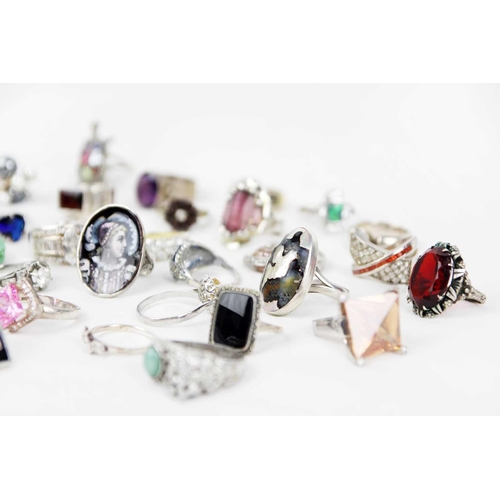 267 - A collection of silver stone and paste set rings. Including a silver gilt ring set with white and bl... 