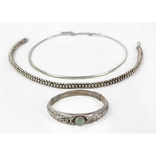 296 - A silver white metal bead cluster choker, a silver collar and a Chinese white metal bangle. The bead... 