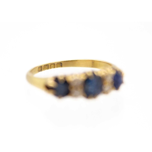 3 - An Edwardian 18ct hallmarked gold diamond and sapphire set ring. Set with three oval cut blue sapphi... 