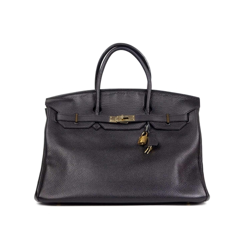 303 - HERMES - A Birkin 40 black Togo leather retourne handbag, circa 2008. With polished gold-tone hardwa... 