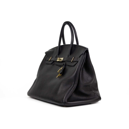 303 - HERMES - A Birkin 40 black Togo leather retourne handbag, circa 2008. With polished gold-tone hardwa... 