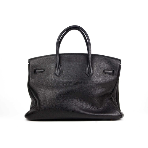 303 - HERMES - A Birkin 40 black Togo leather retourne handbag, circa 2008. With polished gold-tone hardwa... 