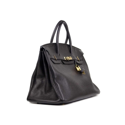 303 - HERMES - A Birkin 40 black Togo leather retourne handbag, circa 2008. With polished gold-tone hardwa... 