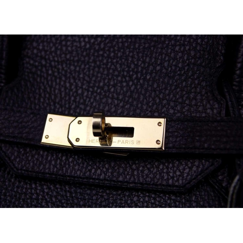 303 - HERMES - A Birkin 40 black Togo leather retourne handbag, circa 2008. With polished gold-tone hardwa... 