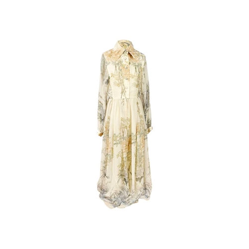 306 - JEAN VARON - A 1970's maxi dress. Printed with autumnal foliage and a game bird on a cream ground, l... 