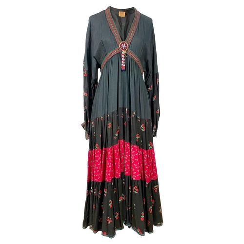 308 - A 1970's Afghanistan black and red cotton maxi dress. The front with beaded detail, length 52