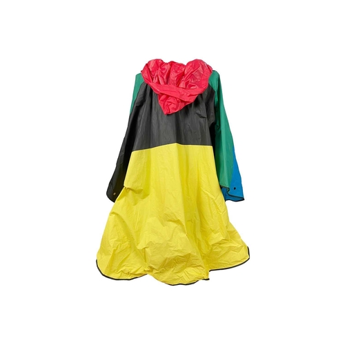 311 - MARY QUANT - A poncho and a printed blouse. The poncho in blue, green, red and yellow PVC; the blous... 