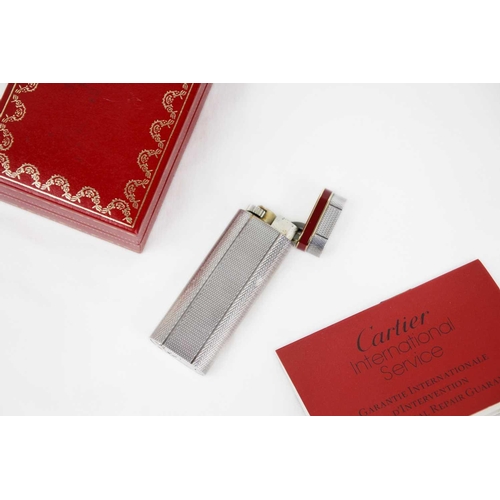 316 - MUST DE CARTIER - A silver plated Grain D'orge lighter with burgundy enamel band. Serial number 1177... 