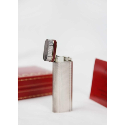 316 - MUST DE CARTIER - A silver plated Grain D'orge lighter with burgundy enamel band. Serial number 1177... 