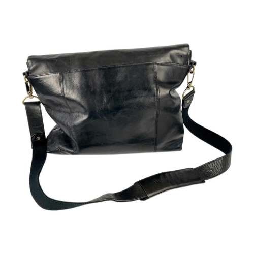 317 - A Tumble & Hide black leather messenger bag. Width 38cm. With dust cover and papers.