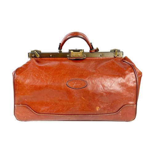 318 - A Texier France tan leather Gladstone type bag. With brass hardware and two interior zips, width 45c... 