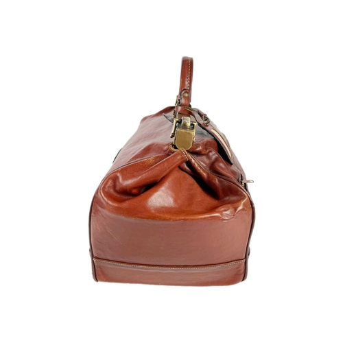 318 - A Texier France tan leather Gladstone type bag. With brass hardware and two interior zips, width 45c... 