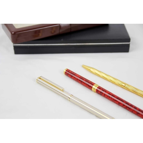 321 - Two SJ Dupont ball pens together with Givenchy ball pen The red pen is Paris Laque de Chine , the go... 