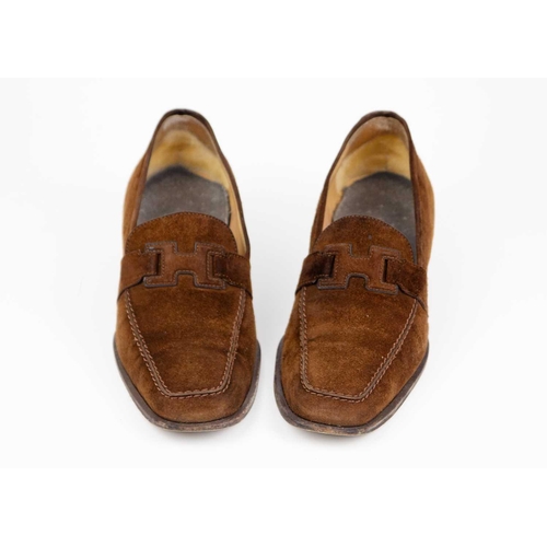 325 - Two pairs of Hermès shoes. A pair of brown suede loafers, UK size 6, with a pair of black leather po... 