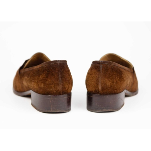 325 - Two pairs of Hermès shoes. A pair of brown suede loafers, UK size 6, with a pair of black leather po... 