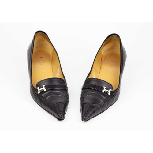 325 - Two pairs of Hermès shoes. A pair of brown suede loafers, UK size 6, with a pair of black leather po... 