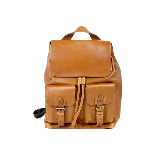 326 - ASPINAL OF LONDON - A heritage style tan leather drawstring backpack. The front with a pair of envel... 