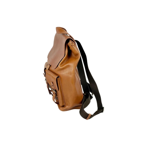 326 - ASPINAL OF LONDON - A heritage style tan leather drawstring backpack. The front with a pair of envel... 