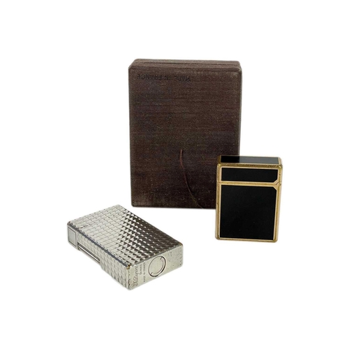 353 - S. T. DUPONT - Two lighters. One in a chrome nickel case, with box and papers, the other gold plated... 