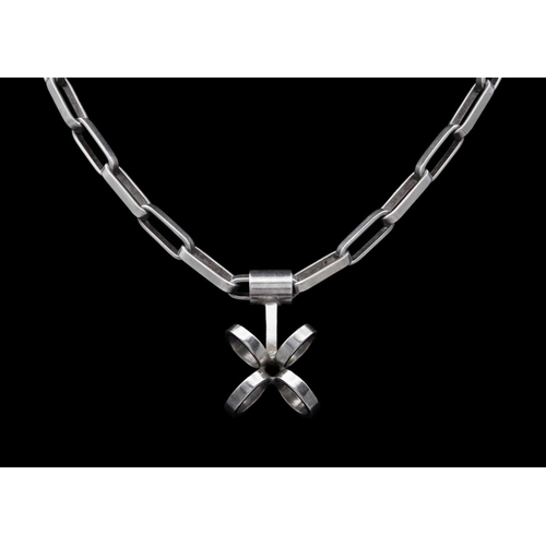 40 - Karl Ingemar Johansson - A Swedish silver pendant necklace and bracelet. The necklace with paperclip... 