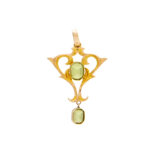 5 - A 15ct Art Nouveau peridot set pendant. Set with two emerald cut peridot, the largest is 6 x 5mm, st... 