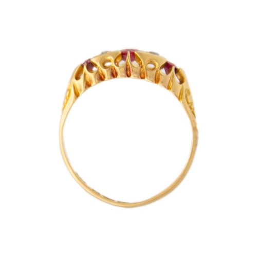 50 - A Victorian 18ct hallmarked gold diamond and ruby set five stone ring. In a boat shaped setting, Che... 