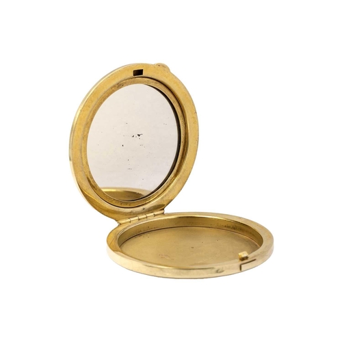 55 - A modern silver gilt compact applied with a 9ct garnet and diamond crescent. The engine turned compa... 