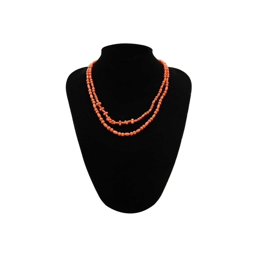 61 - An Opera length coral bead necklace. With round and oval beads, length 88cm approximately.