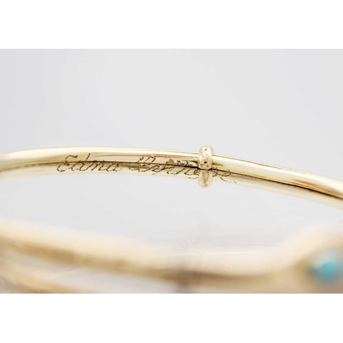 64 - A Victorian gold-plated turquoise set snake bangle. With floral scroll engraved decoration, expandin... 