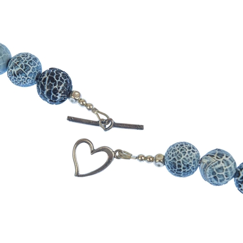 78 - HELEN FEILER - A volcanic blue and white stone and silver bead necklace. Length 45cm.