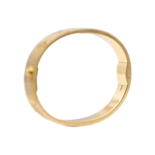 8 - CARTIER - An 18ct rose gold diamond set 'love' bangle. The polished oval band pavé-set throughout wi... 