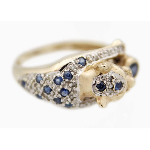 80 - A 9ct leopard design ring set with diamonds, sapphires and cabochon ruby eyes. London import hallmar... 