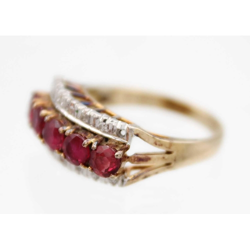 81 - A 14ct ruby and diamond set ring. Set with a row of five round cut rubies each of 0.20ct, and a flan... 