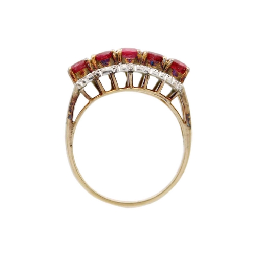 81 - A 14ct ruby and diamond set ring. Set with a row of five round cut rubies each of 0.20ct, and a flan... 