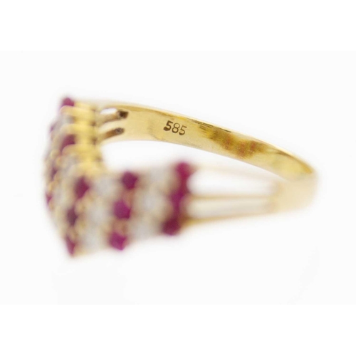 94 - A 14ct gold red spinel and CZ set wishbone ring. Stamped 585, size M, 3.29g.