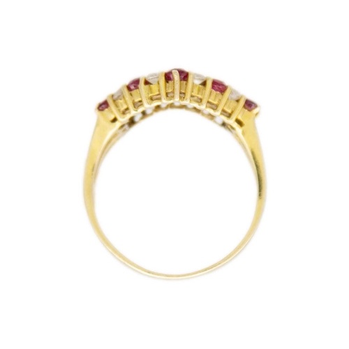 94 - A 14ct gold red spinel and CZ set wishbone ring. Stamped 585, size M, 3.29g.