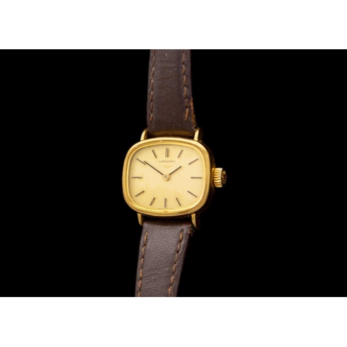 102 - LONGINES - A gold-plated gent's quartz wristwatch and a lady's manual wind wristwatch. The gent's wa... 