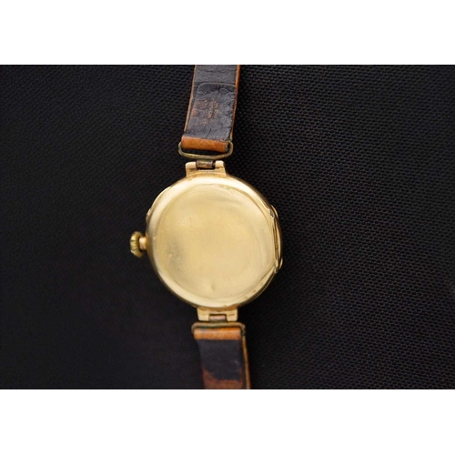 106 - An early 20th century 18ct cased lady's manual wind wristwatch. The white enamel dial with Roman num... 