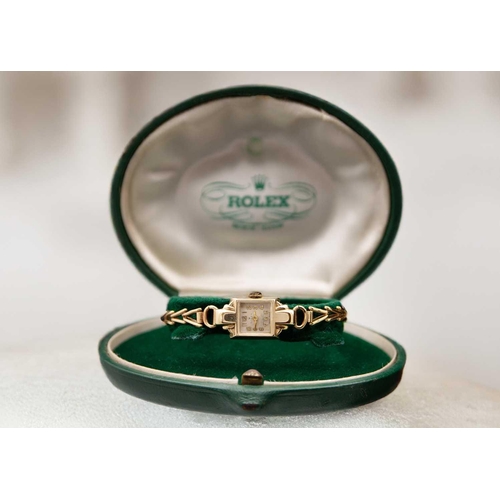 114 - ROLEX - A 9ct lady's manual wind bracelet wristwatch. The signed silvered dial with gilt Arabic nume... 