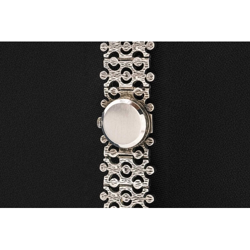 118 - JEAN RENET - A 1970's silver retro lady's manual wind bracelet wristwatch. With signed 13mm silvered... 