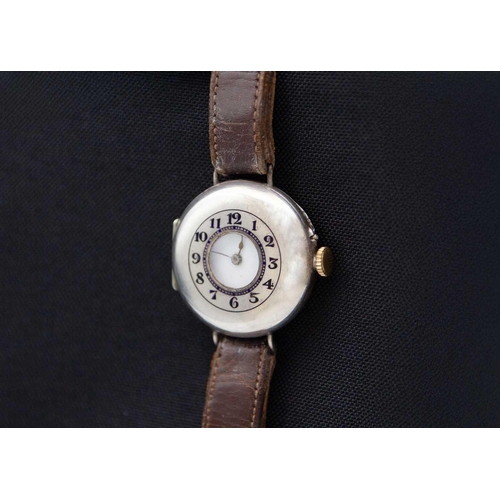 121 - An early 20th century silver cased half hunter Swiss cylinder lug wristwatch. The white enamel dial ... 