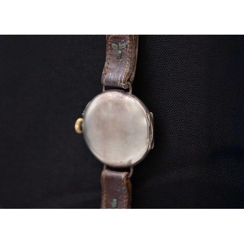 121 - An early 20th century silver cased half hunter Swiss cylinder lug wristwatch. The white enamel dial ... 