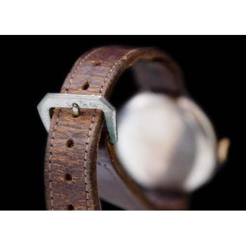 121 - An early 20th century silver cased half hunter Swiss cylinder lug wristwatch. The white enamel dial ... 