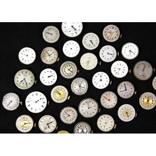 181 - A quantity of mid-sized circular manual wind wristwatch movements and dials for repairs and spares. ... 