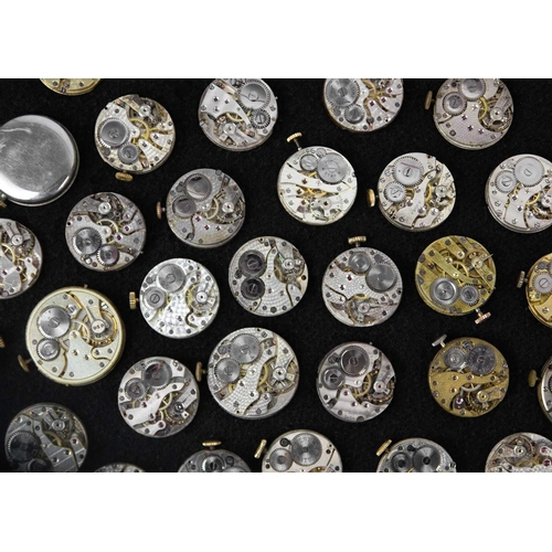 181 - A quantity of mid-sized circular manual wind wristwatch movements and dials for repairs and spares. ... 