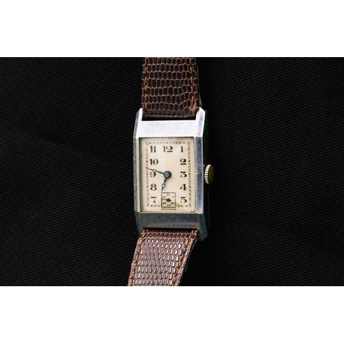 198 - Three Art Deco gentleman's manual wind tank wristwatches. One in a silver case, with a silvered rect... 