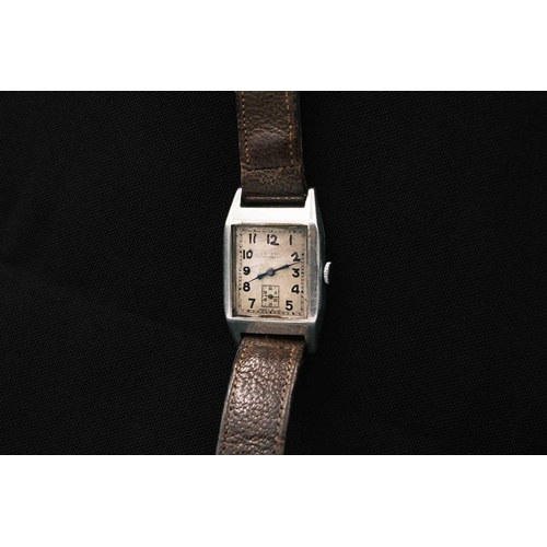 198 - Three Art Deco gentleman's manual wind tank wristwatches. One in a silver case, with a silvered rect... 